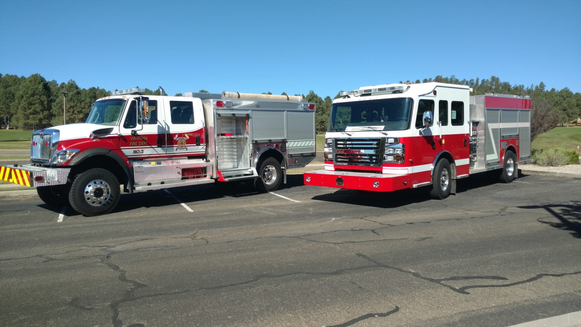 Two Fire Trucks in White and Red Color Body