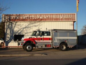A fire truck in front of the Artesia Fire Equipment building