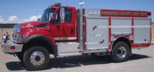 La Cueva fire truck with a red cabin and white body