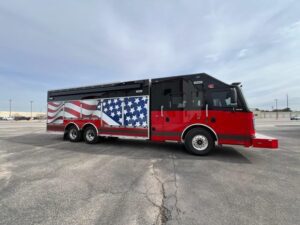 side view of a truck with the USA Flag on it